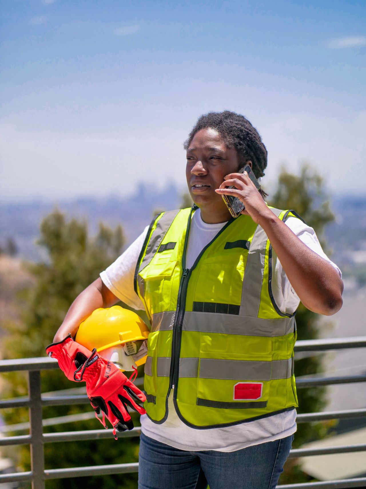 Construction professional speaking on a phone at a work site
